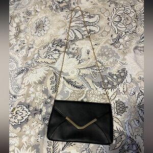 small formal purse black with gold chain  detail